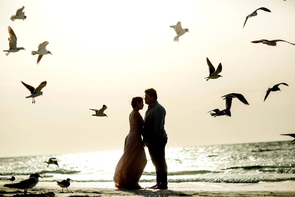 Couple watching the sunset in Maui, Hawaii